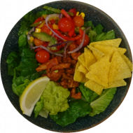 Bunte Taco-Bowl 'Al Pastor' mit marinierten Schweinestreifen, Tortillachips, Avocado, Kirschtomaten (3,51,81)
